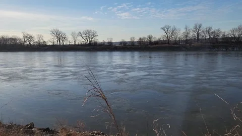 Calm river with subtle currents and smooth water texture in winter Stock Footage 331317479
