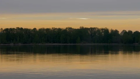 Calm River at sunrise with reflection pan across Vídeo Stock 107123077