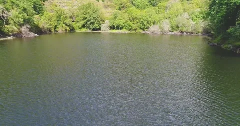 Calm river surface with ripples the concept of tranquility and peace Stock Footage 326062019