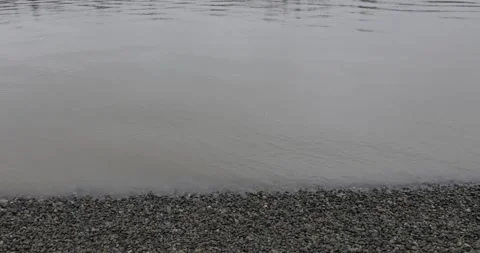 Calm river waves panning upwards Stock Footage 145699644