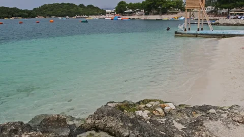 Calm Sandy Beach with Soft Waves near Turquoise Water in Albania, Ksamil Stock Footage 170630154