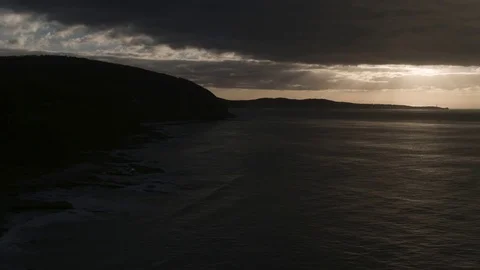 Calm sea and mountain on side during sunrise Stock-Footage 81000259
