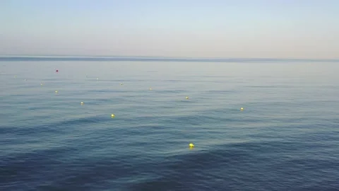 Calm sea at dawn with small waves Stock Footage 200213291