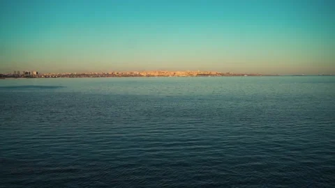 Calm Sea at Evening with Distant Coastline Stock Footage 340501879