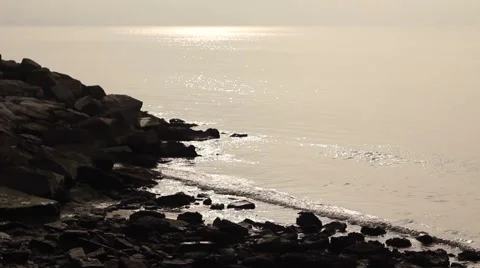 Calm sea with rocks at the sunset Stock Footage 47993581