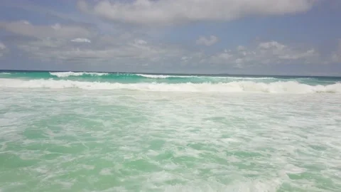 Calm sea with small waves on the coast of a very popular resort in high season Video stock 120548717