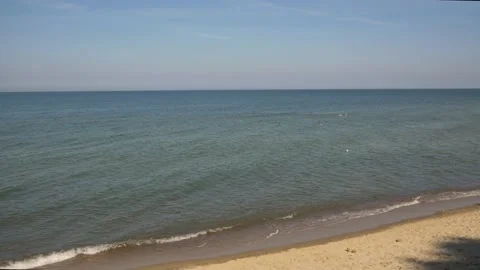 Calm sea with small waves, sandy beach, no people, general plan, day Stock Footage 165730127