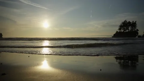 Calm Sea at Sunset with Sun Reflection on Sand Stock Footage 313812343
