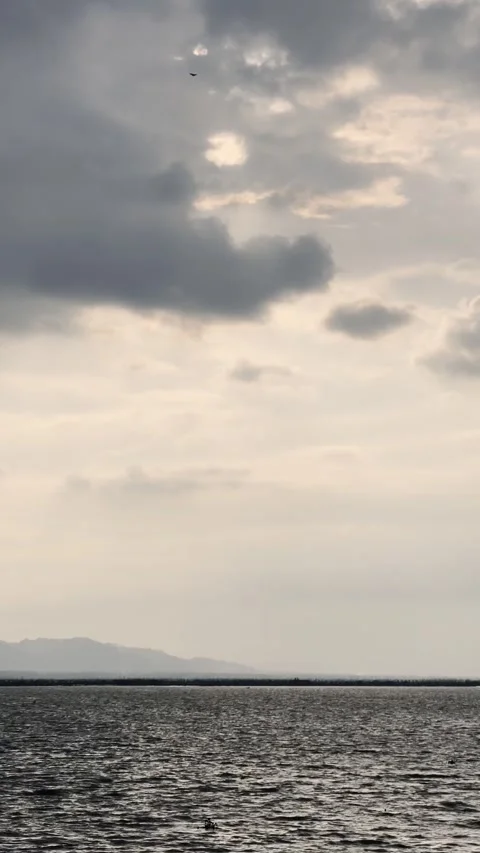 Calm Sea Under Cloudy Sky Stock Footage 336676034