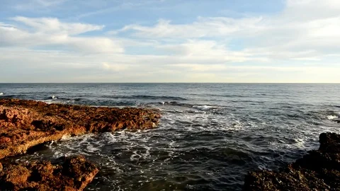 The calm sea in a very cloudy sunset Stock Footage 83462411