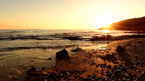 The calm sea in a very cloudy sunset Stock Footage 83687497