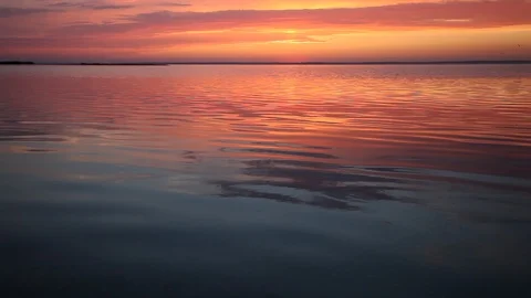 Calm sea water surface. Sunset water reflection Stock Footage 87618992