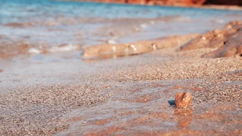 Calm sea water washes gently onto a warm sandy beach. Stock Footage 337405552