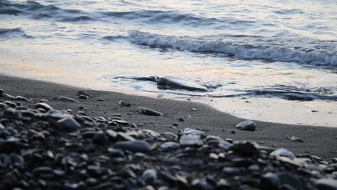 Calm sea waves hitting the shore in the evening. Stock Footage 203200316