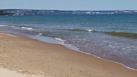 Calm Sea Waves Lapping on the Sandy Beach in Summer Stock Footage 309152004