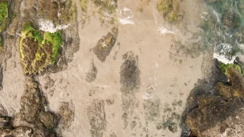Calm Sea Waves Rocky Shore with Rocks Top Down Stock Footage 235662053