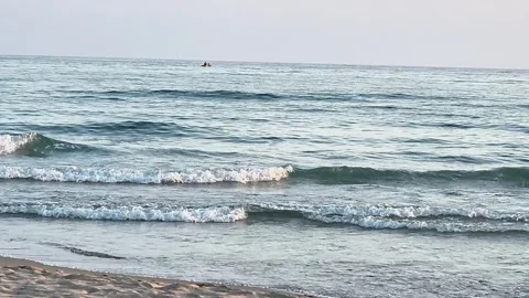 Calm Sea Waves Rolling Onto Sandy Beach at Peaceful Sunset Coast Stock Footage 341915561