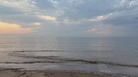 Calm Sea Waves at Sunset in 4K Gentle Shoreline and Natural Ocean Sound Stock Footage 321455998