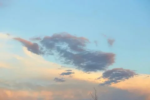 Calm sky with colorful clouds during sunset or sunrise Stock Photos