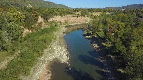 Calm slow mountain river. The drone slowly flies over the surface of the river Stock Footage 141649047