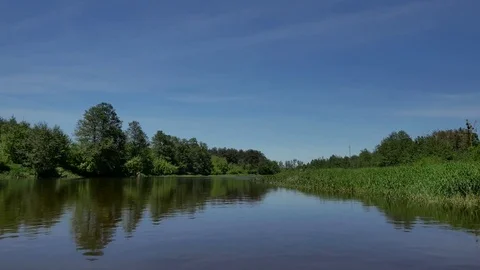 Calm, small river in spring time.  Stockbeeldmateriaal 76250881