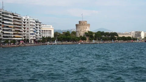 Calm small waves in deep blue sea in amazing ancient Greece port city modern Stock Footage 95393072