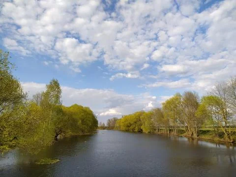 Calm Spring River Under Beautiful Cloudy Sky Stock Photos