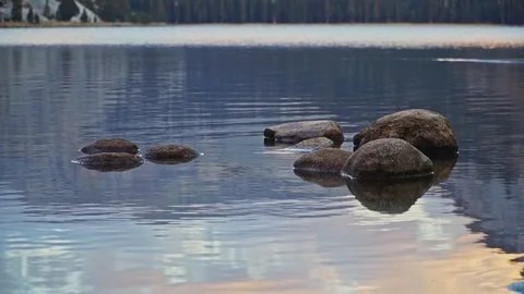 Calm stones on Tenaya Lake Medium Shot Stock Footage 106240587