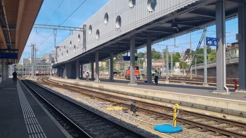 A calm summer day at Bern Central Station captures commuters and travelers Stock Footage 344035330