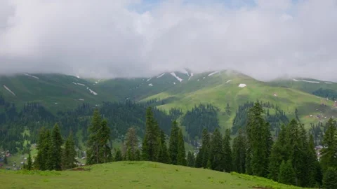 Calm summer setting featuring snow patches and majestic ridges Video stock 331940224