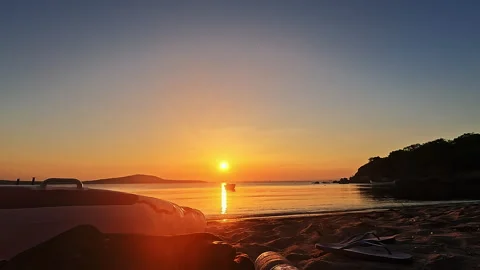Calm Sunset Beach Sea Background With Boat Video stock 335698925