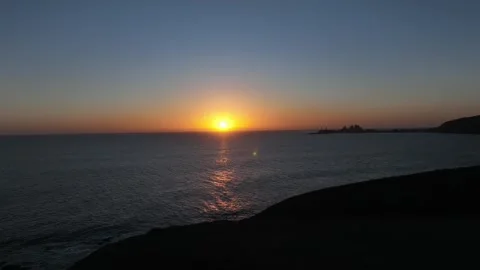 Calm Sunset Waves Along Coastline with Silhouetted Pier – Gran Canaria Aerial Stock Footage 309940518