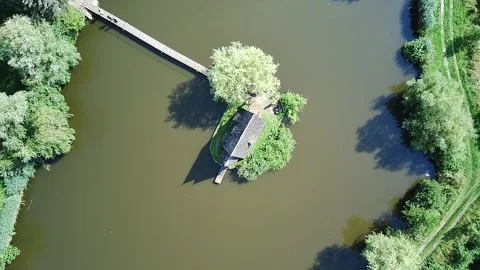The Calm Surface Of A Forest Lake With A Reflection Of The Sky And A Small I 库存影片 339171154