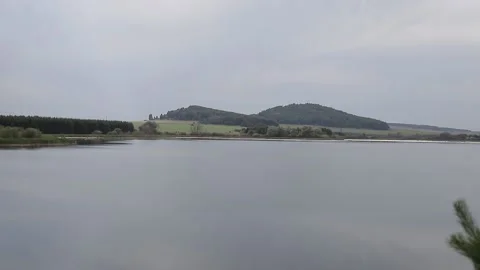 Calm surface of water and forest Stock Footage 146574072