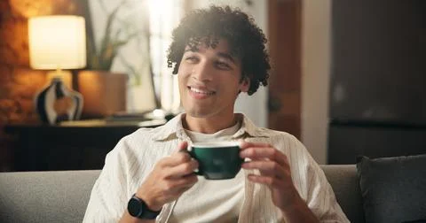 Calm, thinking or man on couch with coffee, memory or insight with morning .. Stock Photos
