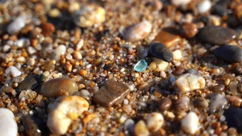 Calm tranquil waves lapping on a pebble beach Stock Footage 132100938