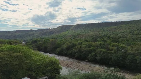 Calm tropical river under blue sky, Aerial footage of natural Colombian scenery Stock Footage 320146194
