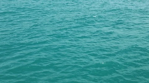 Calm turquoise ocean surface waves ripple gently Stock Footage 92535068