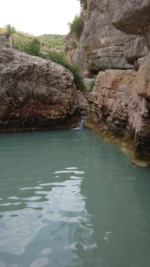 Calm Turquoise Rock Pool Between Natural Canyon Cliffs - 4k Vertical Footage Video stock 337964966