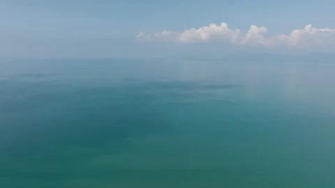Calm turquoise sea with reflections and blue sky. Ko Samui, Thailand. Stock Footage 305129527