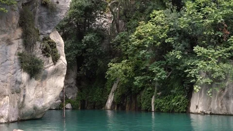 Calm turquoise water surface on bottom of mountain canyon Stock Footage 143307761