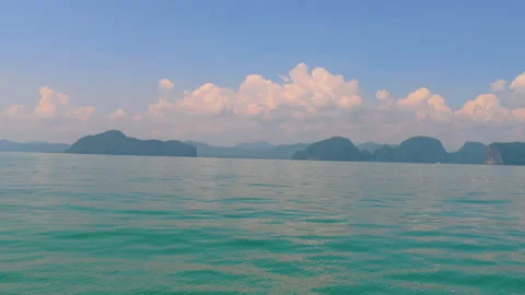 Calm turquoise waters of Phuket with distant islands and clear skies Video stock 310696978