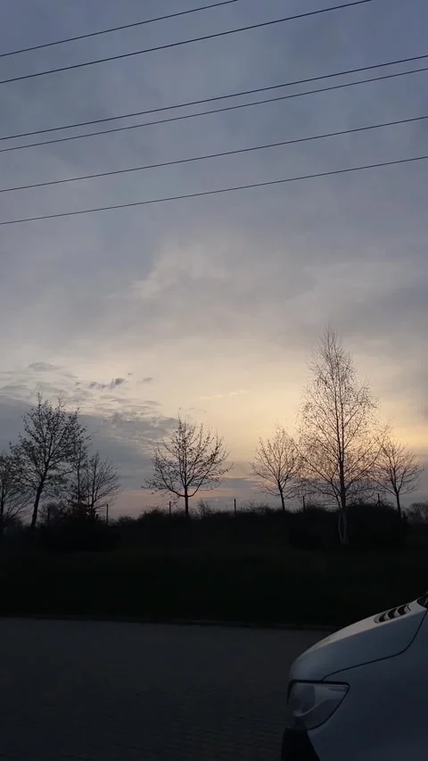 Calm twilight scene featuring countryside and glowing horizon Stock Footage 335366480