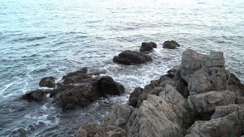 A calm view of the beautiful, clear, blue, summer Adriatic Sea and surrounding r Stock Footage 106572909