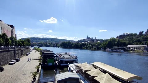 Calm Vltava River And Distant Bridges View From Prague Promenade - May 30 2026 Stock Footage 336384997