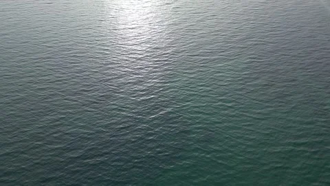 Calm water surface reflecting sunlight aerial Stock Footage 296088641