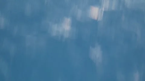 Calm water surface with small waves and pink shimmer at sunset, aerial view of Stock Footage 340532950
