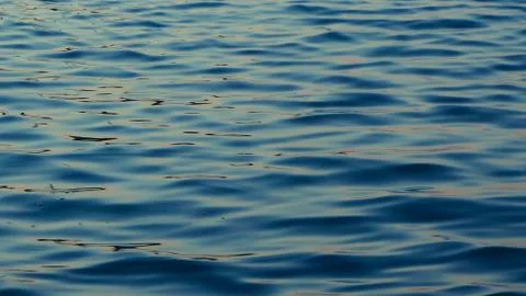 Calm water surface waves texture background wallpaper Foto stock