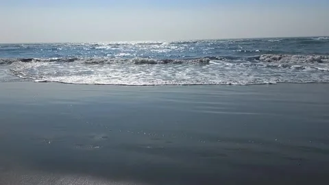 Calm water waves on the beach Video stock 274557383
