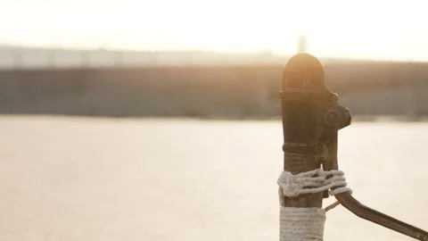 Calm Waters and Golden Sunsets by the Serene Dock at the Harbor Stock Footage 344928448